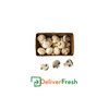 Box of mushrooms labeled 'Mushroom Button -(1 Kg)' with 'DeliverFresh'