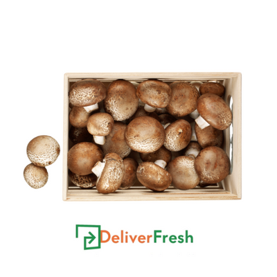 Box of Portobello mushrooms with 'Deliver Fresh' 