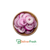 Sliced onions in a wooden bowl with 'Deliver Fresh' 