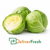 Fresh green cabbage showing whole and cut section, farm fresh quality