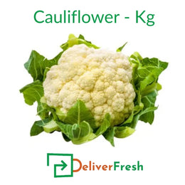 Fresh whole cauliflower with green leaves by DeliverFresh