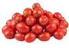 Pile of red tomatoes on a white background