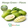 Fresh raw green mango pieces with whole and sliced mango, ideal for pickles and cooking