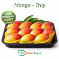Fresh ripe mangoes neatly packed in a tray, premium wholesale fruit display