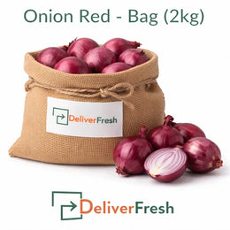Fresh red onions packed in a 2kg bag with cut onion showing layers on a pure white background by DeliverFresh