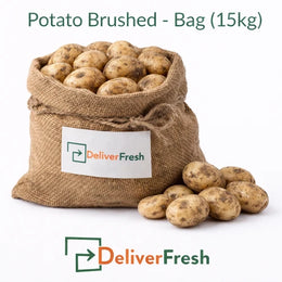 Fresh brushed potatoes packed in a 15kg burlap bag on a pure white background by DeliverFresh