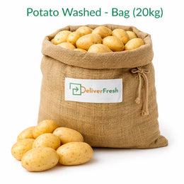 Fresh washed potatoes packed in a 20kg burlap bag on a pure white background by DeliverFresh