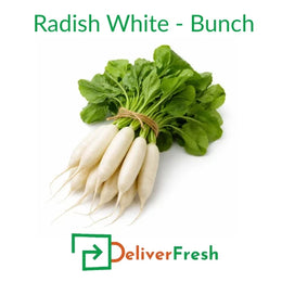 Fresh white radish bunch with green leaves tied together on a pure white background by DeliverFresh
